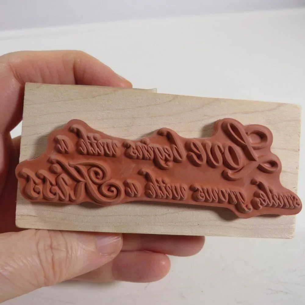 Love begins with a smile...Wood Block Word Rubber Stamp